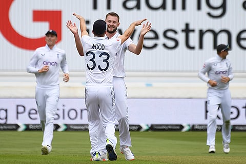 Gus Atkinson celebrates Kevin Sinclair's wicket